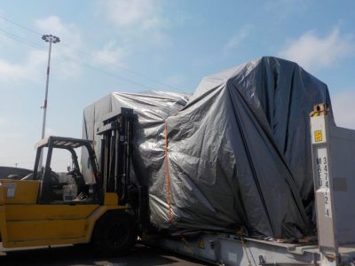 Wrapped Corn Harvester Next to Forklift